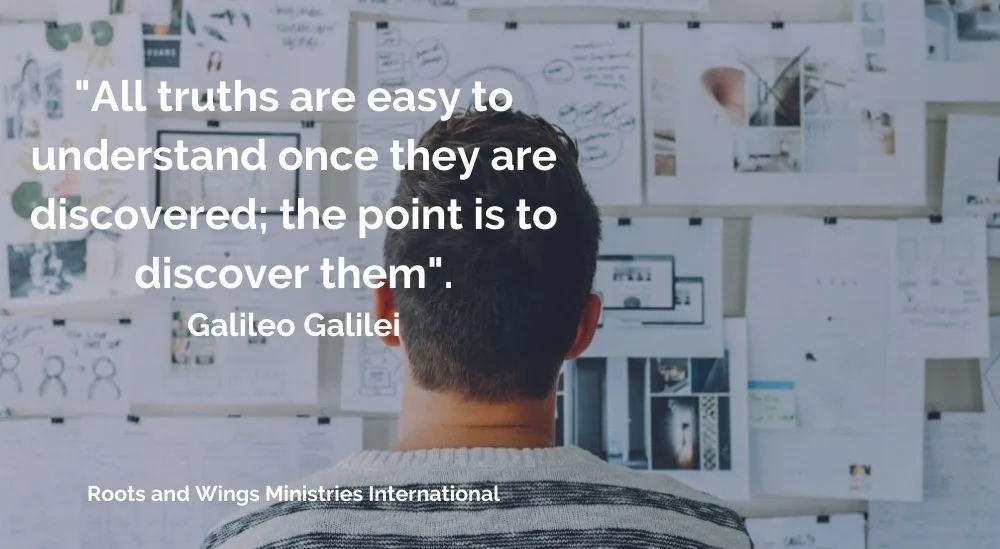 Young man at whiteboard trying to gain understanding